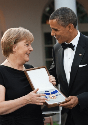 merkel-whitehouse President Barack Obama presents Chancellor Angela Merkel of Germany with the Presidential Medal of Freedom during the State Dinner in the Rose Garden of the White House, June 7, 2011. (Official White House Photo by Pete Souza)